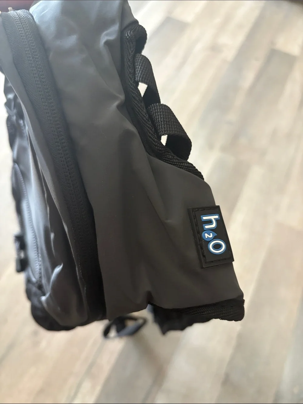 Gray reflective Backpack with water hose compartment